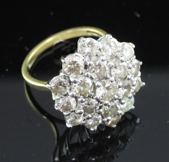 A late 1970s 18ct gold and diamond cluster ring, size O.
